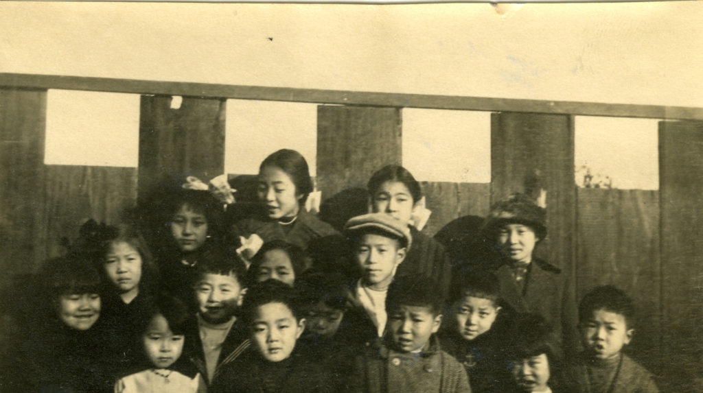 Fr. Wu ministry. SS teacher and children in front of Clay St. c1920s